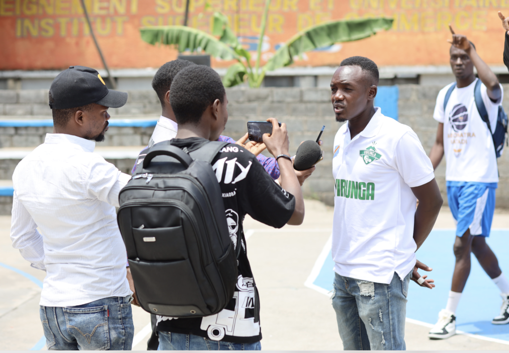 DC Virunga women’s Coach Kevin, with the press